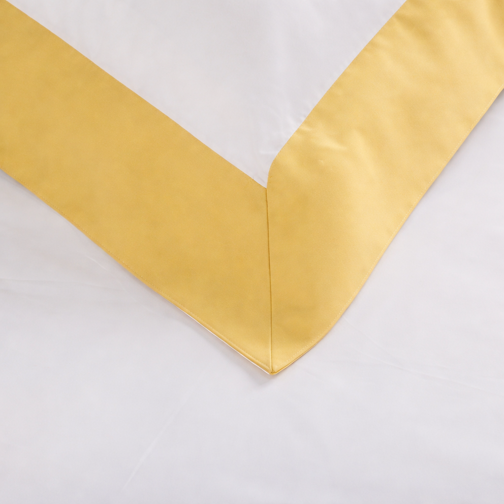 Close-up of a yellow fabric border on a white background