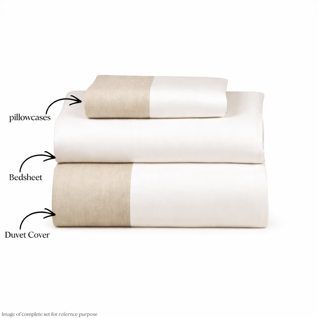 Bedding set with duvet cover, bedsheets, and pillowcases on a white background