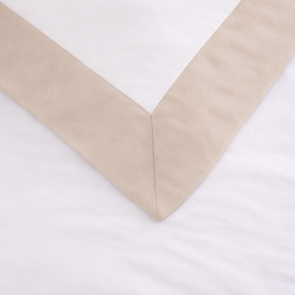 Beige bedskirt corner on a white background